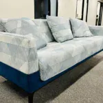 Right_Path_RecoveryRio_IOP11 - Right Path Recovery San Diego - Right Path Recovery San Diego Blue and light gray geometric-patterned sofa with matching cushions in a modern office lounge area.