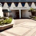 Right_Path_RecoveryRio_IOP45 - Right Path Recovery San Diego - Right Path Recovery San Diego Facade of the 8885 Rio Vista Building with an open entryway and landscaped planters in the foreground